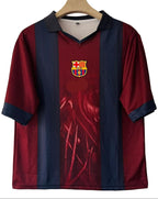 Maroon and blue sports jersey with a logo on a hanger against a beige wall