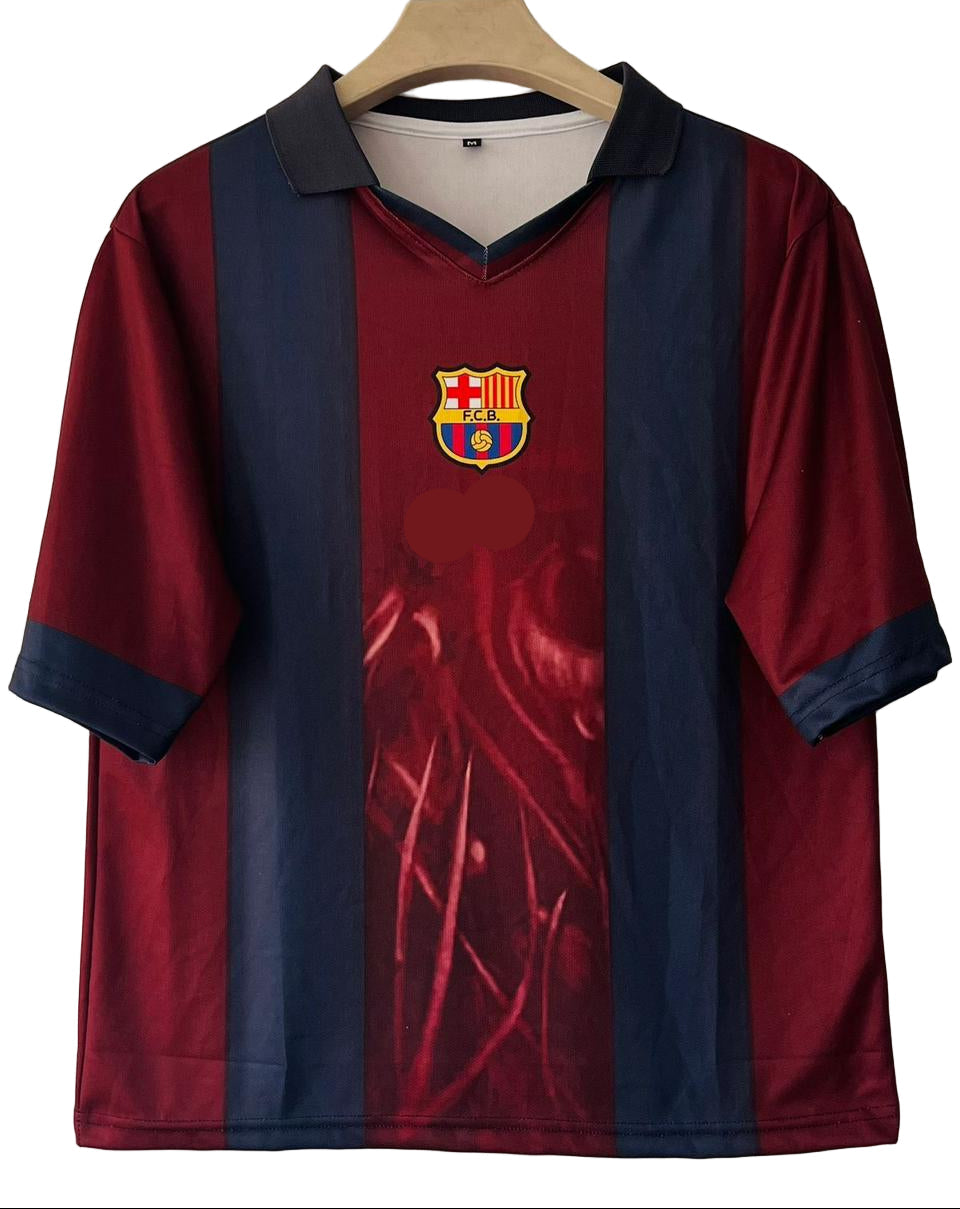 Maroon and blue sports jersey with a logo on a hanger against a beige wall